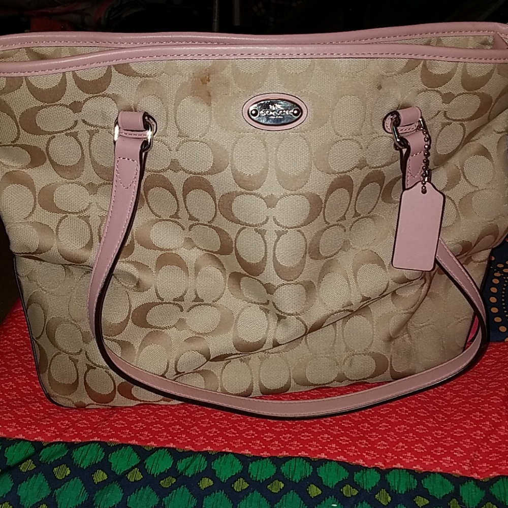 Pink and cream coach purse